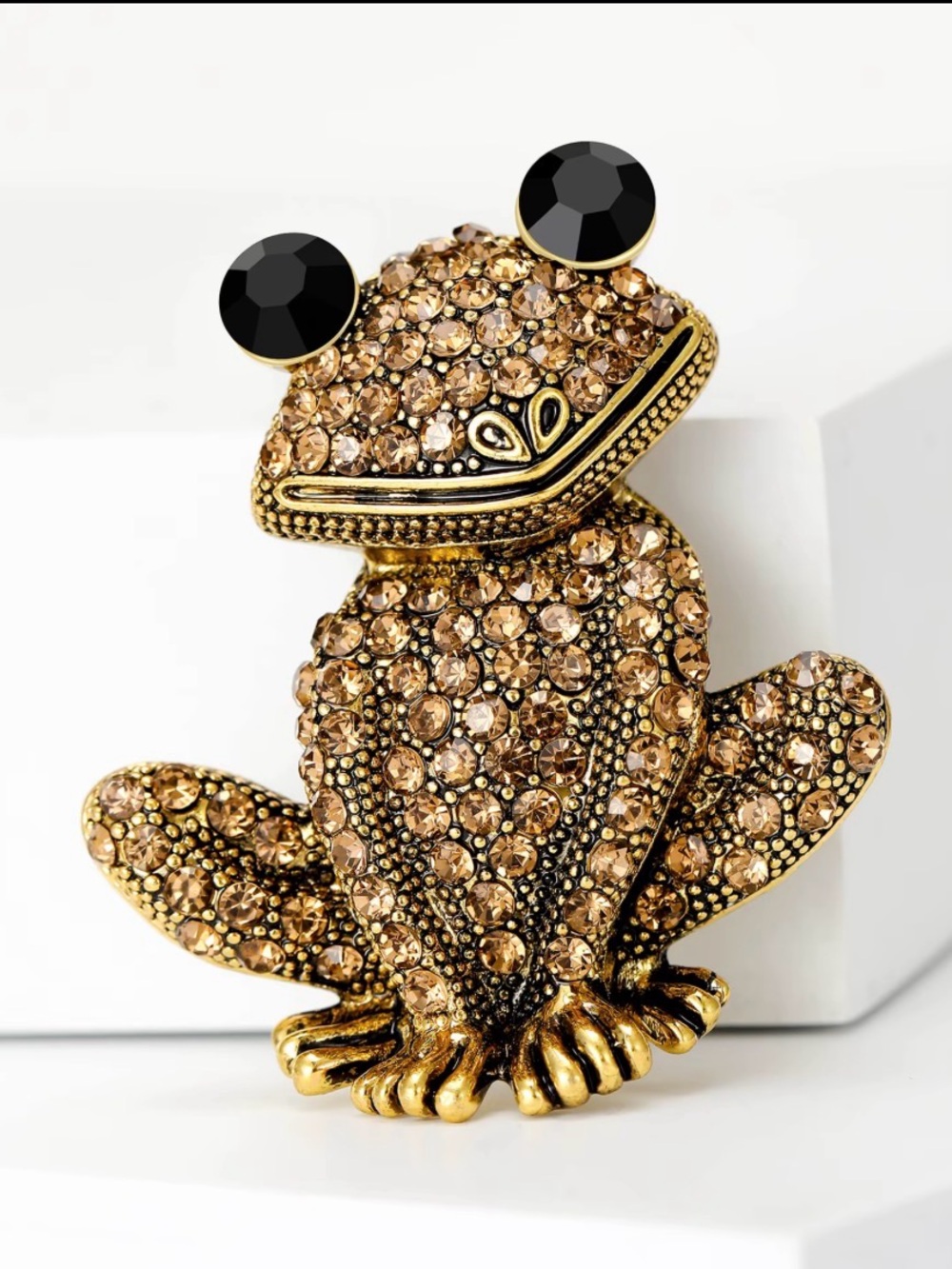 Golden rhinestone frog brooch